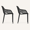 Studio side | two matte-black open-mesh armchairs in full side profile