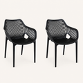 Studio three-quarter | two matte-black open-mesh armchairs turned to show the seat depth and arm openings