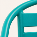 Hardware | close detail of the teal curved chair rail and horizontal back slats