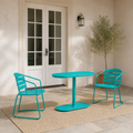 Scale | teal folding bistro set beside a full-height patio doorway for scale