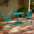 In a room | teal oval folding bistro set on a sage garden veranda with red-clay tile