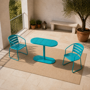 High three-quarter balcony view of the teal table and both matching folding chairs
