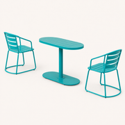 Side | side studio view showing the teal chairs, oval tabletop, pedestal and long base