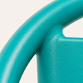 Texture | macro of the matte teal powder-coated iron on the curved chair rail