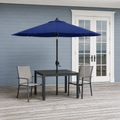 Scale | navy market umbrella through patio table beside full-height French doors for scale
