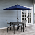 In a room | navy market umbrella over black slatted table on blue-gray porch before French doors