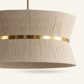Fabric | close view of the rope wrap, brass waist band, and open top
