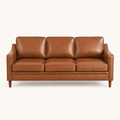 Front | Chestnut faux-leather three-seat sofa straight on in a clean warm-white studio