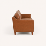 Side profile | Left-side studio view showing the square arm, back profile, and tapered brown wood legs