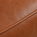 Faux leather texture | Macro of chestnut faux-leather grain and a piped seam