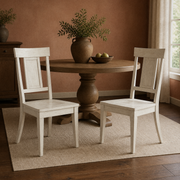 In a room | the set of 2 beside a round table in a warm clay dining room, low afternoon sidelight