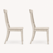 Side | profile view of both chairs showing the tapered leg splay and sabre-curved back legs